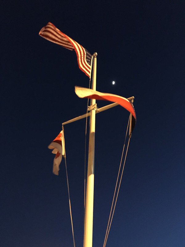 The flagstaff, flags, and moon outside the Red Lobster.