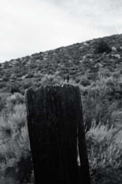 The first in a long line of railroad tie posts. Captured with the Fuji X100S using the in-camera black and white conversion.