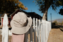 While on walkies with The Girl, this hat and kerchief were hanging on the ranch house fence. Shot with Fuji X100V 23mm f/2 at f/2.8 with Portra film simulation.